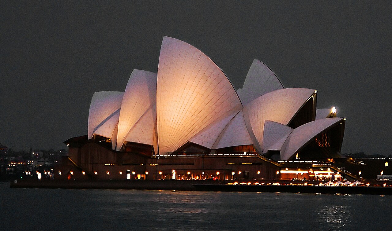 The white shells of Sydney Opera House beside the harbour